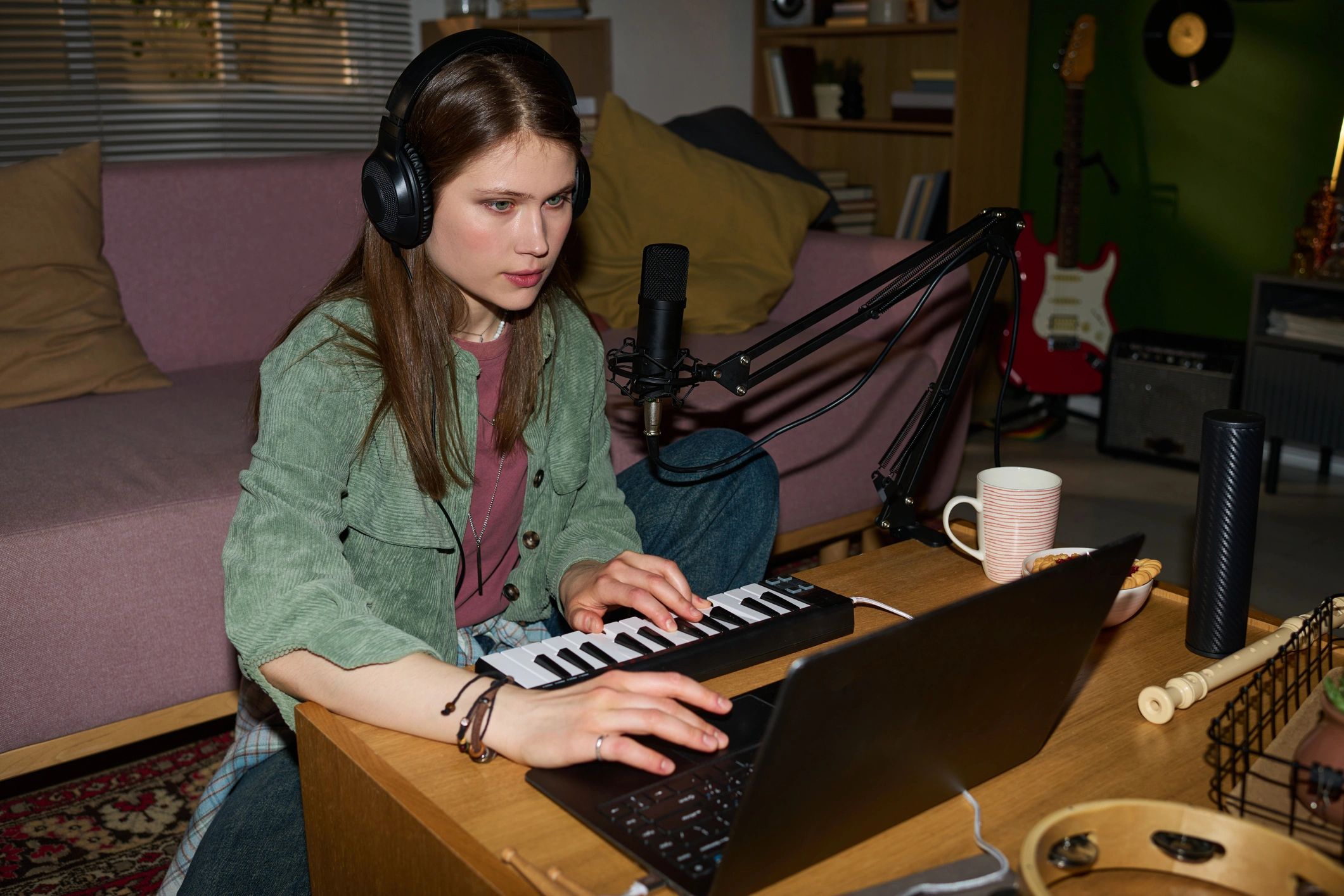 Creator producing music from a home studio
